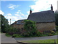 SP6964 : Cottage and house in Harlestone, Northamptonshire by Richard Humphrey