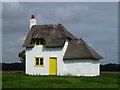 TF3304 : Thatched cottage at Knarr Farm, Thorney Toll - Photo 1 by Richard Humphrey