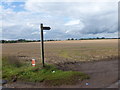 SE7906 : Bridleway sign beside a field of stubble  by Graham Hogg