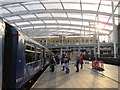 SJ8499 : Manchester Victoria station: waiting to board by Stephen Craven