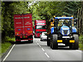 TL8571 : Tractor on the A134 near Ampton by David Dixon