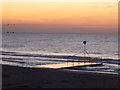 SZ0890 : Bournemouth: the Bourne Stream outfall and an orange sky by Chris Downer