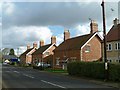 SK9508 : Estate cottages on Main Street by Alan Murray-Rust