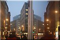 TQ3380 : View of Fenchurch Street reflected in the Vodafone shop by Robert Lamb