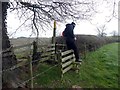 SK7467 : Negotiating a tricky double stile by Graham Hogg