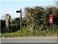 SX0563 : Celtic cross and letterbox by Philip Halling