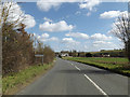 TM1454 : Entering Hemingstone on the B1078 High Street by Geographer