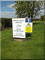 TM1256 : Signs at the entrance to Home Farm by Geographer