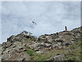 SW3431 : Cape Cornwall - coastguard lookout and chimney by Chris Allen