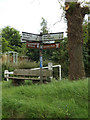 TM0078 : Roadsign & Seat on the C637 Hopton Road by Geographer