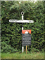 TM1483 : Signpost on Crown Green by Geographer