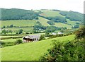 SN6778 : The tiny hamlet of Troed rhiw ceir. Taken from the train by Derek Voller