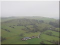 SK1056 : Farm buildings seen from Wetton hill. by steven ruffles