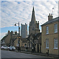 TL5380 : Ely: almshouses, tower and spire by John Sutton