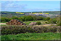 NZ7817 : Timber stack with distant potash mine by David Martin