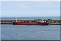 SY6974 : Cargo Ship at the Inner Breakwater by David Dixon