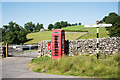 NY5119 : Crowned signpost at road junction by Trevor Littlewood