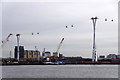 TQ3980 : The Emirates Air Line cable car crossing the Thames to Docklands by Mike Pennington