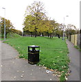 ST3186 : Bilingual text on a bin at the edge of a recreation ground, Pill, Newport by Jaggery