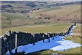 NT2545 : Wall with snowdrift, Cavarra Hill by Jim Barton