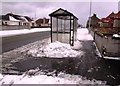 NT3699 : Snow at bus shelter by Bill Kasman