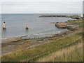 NT7475 : Landing stage and breakwater at Torness by M J Richardson