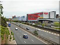 SJ8990 : Redrock across the M60 by Gerald England