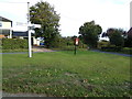 TL9128 : Pound House Postbox & Signpost by Geographer