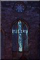 SK2854 : Illuminated Cross in Church Window, Wirksworth, Derbyshire by Andrew Tryon