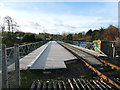 NZ8809 : Ruswarp railway bridge, along the track by Stephen Craven