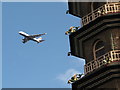 TQ1876 : Kew Gardens pagoda with dragons, airliner above by David Hawgood