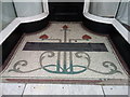 SH6874 : A tiled shop doorway on Village Road, Llanfairfechan by Meirion