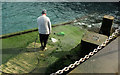 SX9256 : Cleaning the slipway, Brixham by Derek Harper