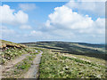 NY9430 : Upland road passing Carrs Hill by Trevor Littlewood