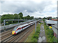 SE2833 : Train to Harrogate passing Armley by Stephen Craven