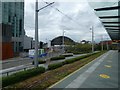 SJ8397 : Tram stop and hospital by Gerald England