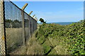 TM3438 : Perimeter fence at RAF Bawdsey by Simon Mortimer