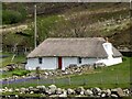 NG5627 : Thatched crofters cottage in Luib by Marika Reinholds