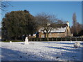 TF1606 : Peakirk village green in the snow by Paul Bryan