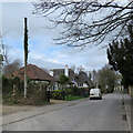 TL3746 : Meldreth High Street: stinkpipe, bungalow and thatch by John Sutton