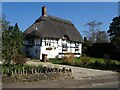 SP0045 : Thatched timber-framed cottage by Philip Halling