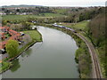 NZ8909 : River Esk and train approaching Whitby by Malc McDonald