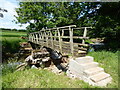 NY6717 : Footbridge near Dougles Ing by Adrian Taylor