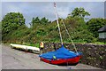 V9070 : Boat and canoe on dry land, near The Pier, Kenmare, Co. Kerry by P L Chadwick