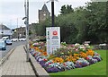 NT4936 : Flower beds and Covid posters, Galashiels by Jim Barton