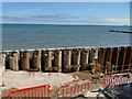 SX9676 : Pile cases for the sea wall by Stephen Craven