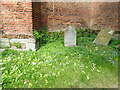 TQ1692 : Flowers in the churchyard of the old church at Stanmore by Marathon