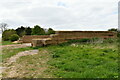 TL7260 : Dalham: Large hardstanding area surrounded on three sides by baled hay by Michael Garlick