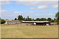 SO9625 : Farm buildings near Cheltenham Racecourse by Chris Allen