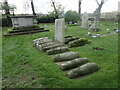 TQ7575 : 'Pip's graves' in Cooling Churchyard by Marathon